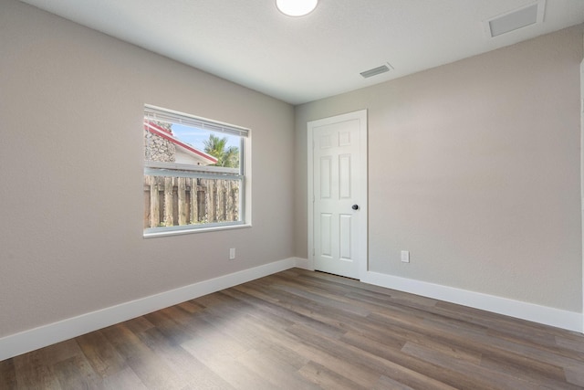 617 54th St, West Palm Beach, FL 33407 - empty room with baseboards and wood finished floors