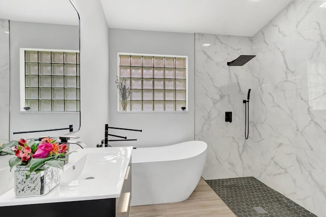 9640 Cherry Blossom Ct, Boynton Beach, FL 33437 - full bathroom featuring vanity, a marble finish shower, a freestanding bath, and wood finished floors