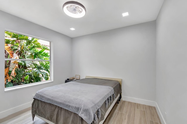 9640 Cherry Blossom Ct, Boynton Beach, FL 33437 - bedroom featuring baseboards and light wood-style flooring