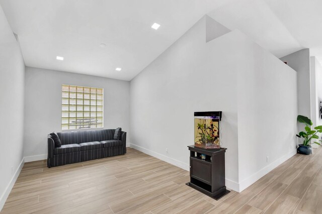 9640 Cherry Blossom Ct, Boynton Beach, FL 33437 - living area with light wood-style floors, baseboards, and lofted ceiling