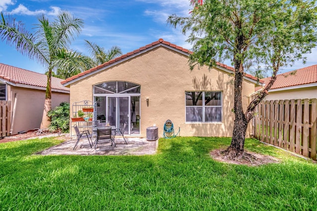 9640 Cherry Blossom Ct, Boynton Beach, FL 33437 - rear view of house featuring stucco siding, a tile roof, and a patio area