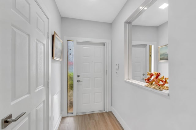 9640 Cherry Blossom Ct, Boynton Beach, FL 33437 - doorway featuring light wood-style flooring and baseboards