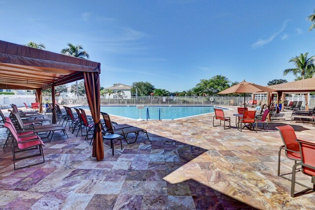 9640 Cherry Blossom Ct, Boynton Beach, FL 33437 - community pool with a patio