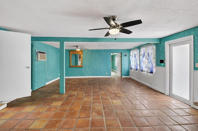 1115 S Seacrest Blvd, Boynton Beach, FL 33435 - empty room with a textured ceiling, ceiling fan, and a wall mounted air conditioner