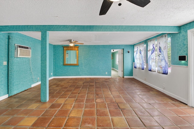 1115 S Seacrest Blvd, Boynton Beach, FL 33435 - empty room featuring ceiling fan, a wall mounted AC, a textured ceiling, baseboards, and tile patterned floors