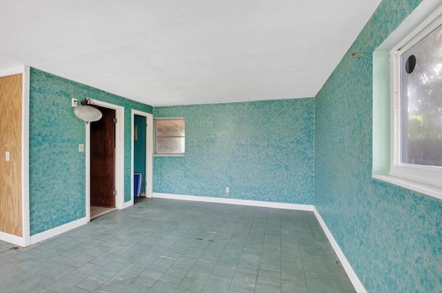 1115 S Seacrest Blvd, Boynton Beach, FL 33435 - empty room with wallpapered walls and baseboards