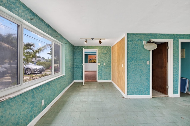 1115 S Seacrest Blvd, Boynton Beach, FL 33435 - unfurnished room with rail lighting and baseboards