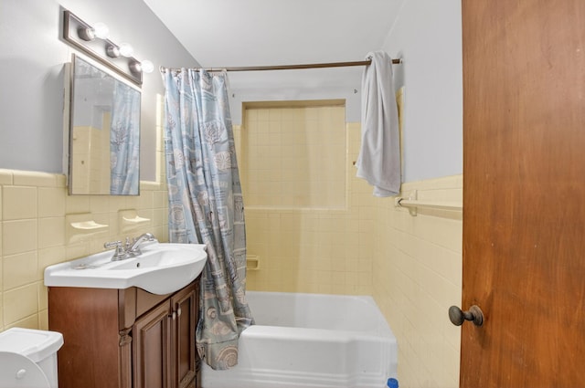1115 S Seacrest Blvd, Boynton Beach, FL 33435 - full bath featuring tile walls, vanity, shower / tub combo, toilet, and a wainscoted wall