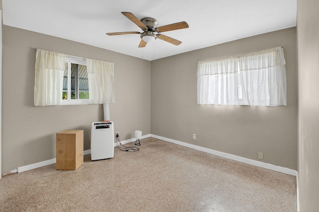 1115 S Seacrest Blvd, Boynton Beach, FL 33435 - unfurnished room featuring a ceiling fan, carpet floors, and baseboards