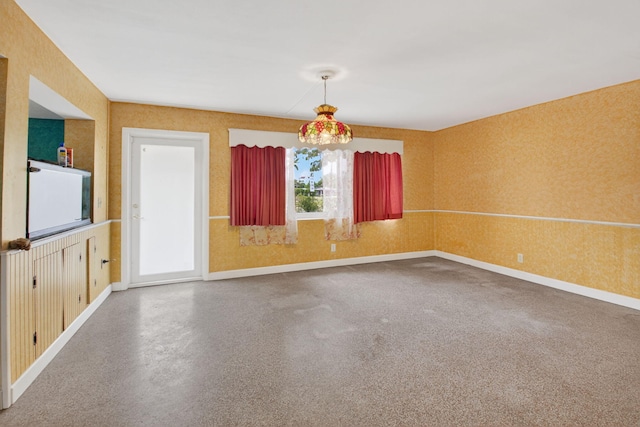 1115 S Seacrest Blvd, Boynton Beach, FL 33435 - unfurnished dining area with baseboards and wallpapered walls