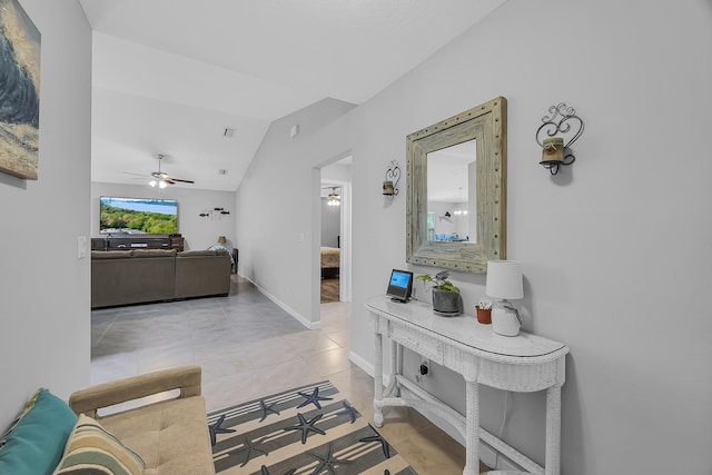 191 SW Glenwood Dr, Port Saint Lucie, FL 34984 - hallway featuring lofted ceiling, tile patterned floors, and baseboards