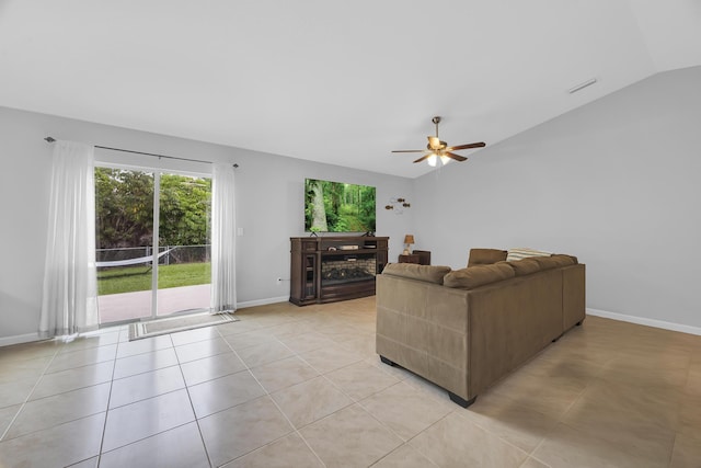 191 SW Glenwood Dr, Port Saint Lucie, FL 34984 - living area with lofted ceiling, a ceiling fan, baseboards, and light tile patterned flooring