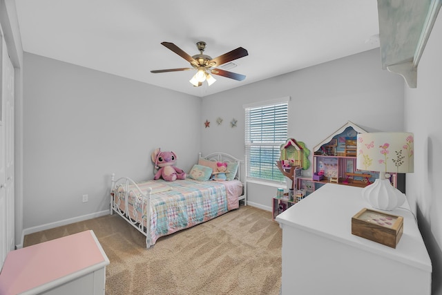 191 SW Glenwood Dr, Port Saint Lucie, FL 34984 - bedroom featuring light carpet, baseboards, and a ceiling fan