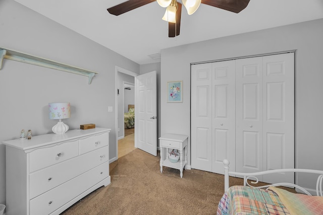 191 SW Glenwood Dr, Port Saint Lucie, FL 34984 - bedroom with light colored carpet, a closet, and a ceiling fan