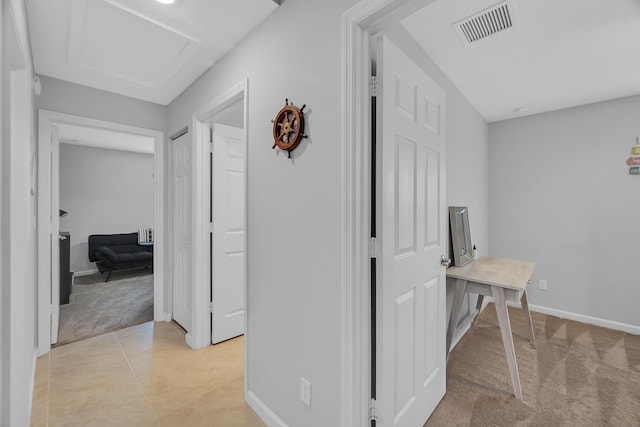 191 SW Glenwood Dr, Port Saint Lucie, FL 34984 - hallway with light carpet, baseboards, and attic access