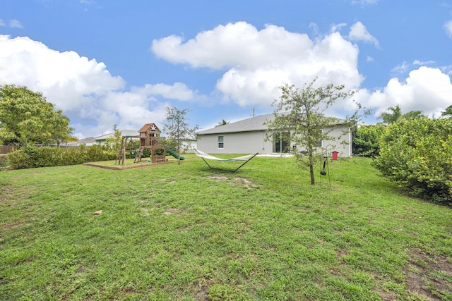 191 SW Glenwood Dr, Port Saint Lucie, FL 34984 - view of green lawn with a playground