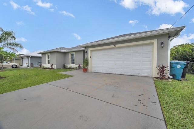191 SW Glenwood Dr, Port Saint Lucie, FL 34984 - single story home featuring concrete driveway, a front yard, stucco siding, and an attached garage
