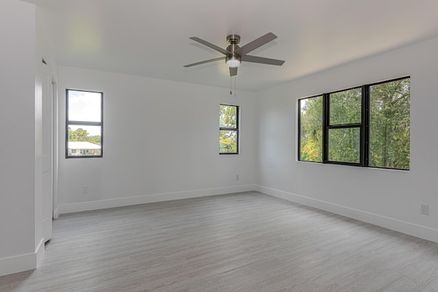 102 Granada St, Royal Palm Beach, FL 33411 - empty room featuring light wood-style flooring, baseboards, and ceiling fan