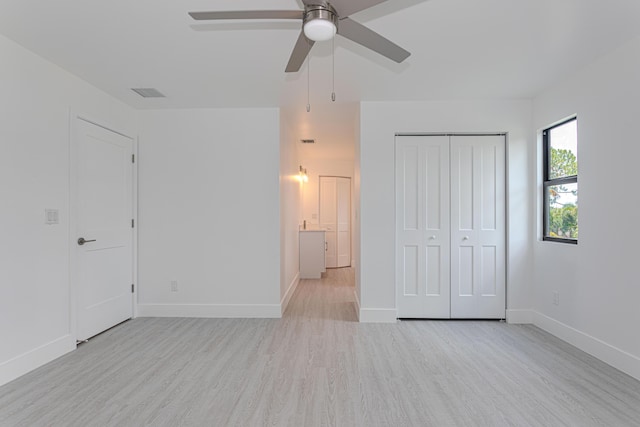 102 Granada St, Royal Palm Beach, FL 33411 - unfurnished bedroom with wood finished floors, baseboards, a closet, and ceiling fan