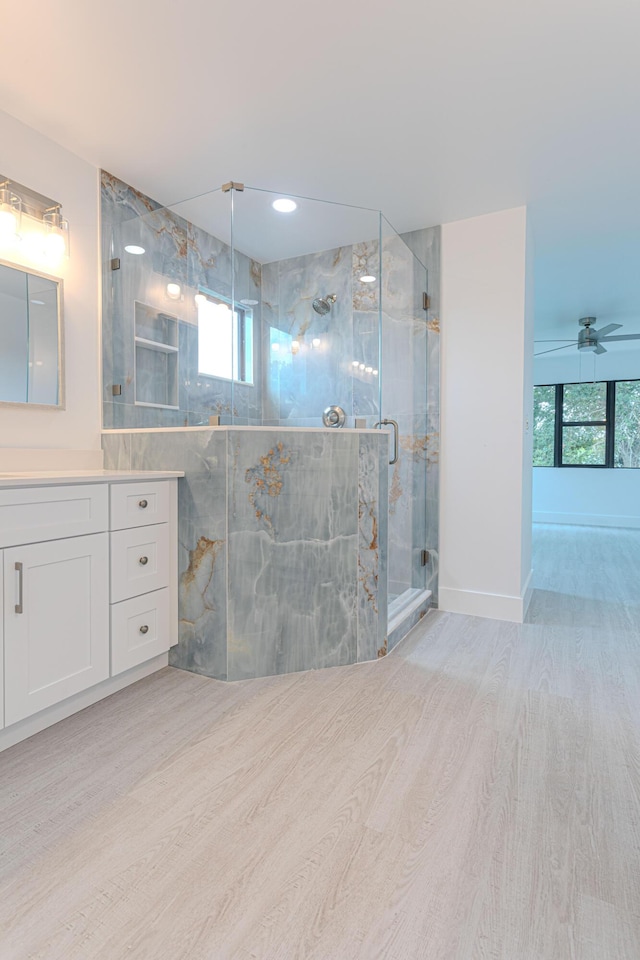 102 Granada St, Royal Palm Beach, FL 33411 - full bath with wood finished floors, vanity, a marble finish shower, and ceiling fan