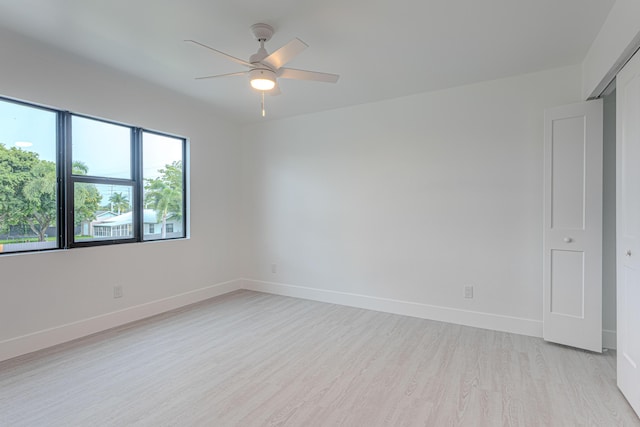 102 Granada St, Royal Palm Beach, FL 33411 - empty room with light wood-type flooring, ceiling fan, and baseboards