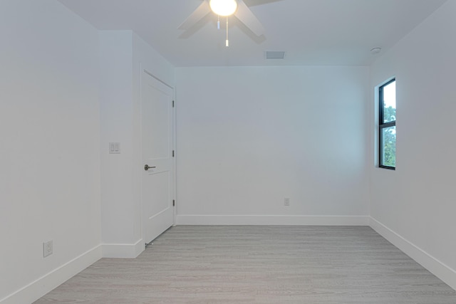 102 Granada St, Royal Palm Beach, FL 33411 - empty room with baseboards, light wood finished floors, and a ceiling fan