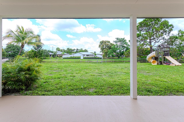 102 Granada St, Royal Palm Beach, FL 33411 - view of yard featuring a playground and a patio