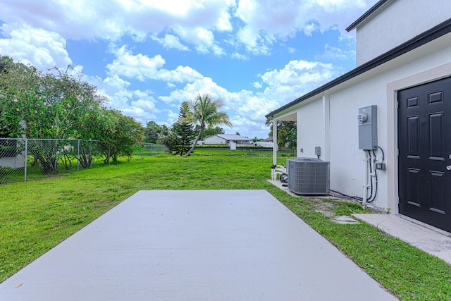102 Granada St, Royal Palm Beach, FL 33411 - view of yard with a patio area and cooling unit