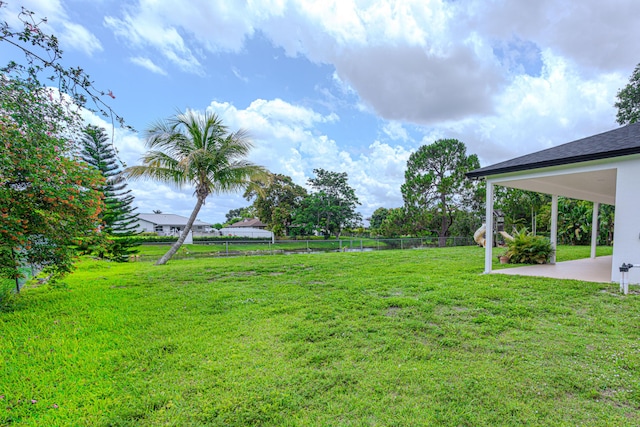 102 Granada St, Royal Palm Beach, FL 33411 - view of yard featuring a patio area and a water view