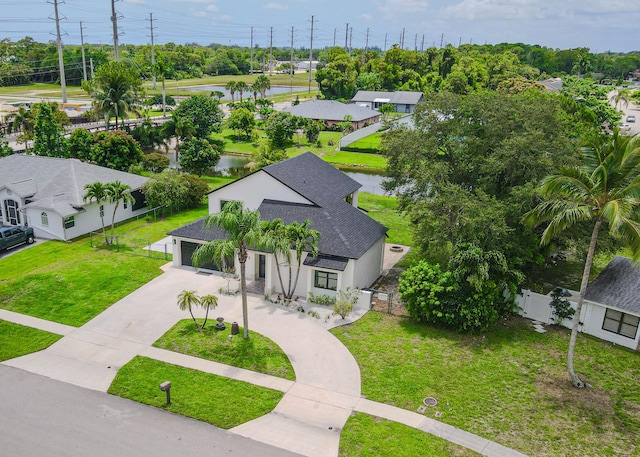 102 Granada St, Royal Palm Beach, FL 33411 - aerial perspective of suburban area featuring a tree filled landscape and a nearby body of water
