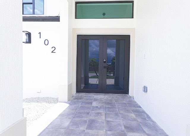 102 Granada St, Royal Palm Beach, FL 33411 - doorway to property with french doors and stucco siding
