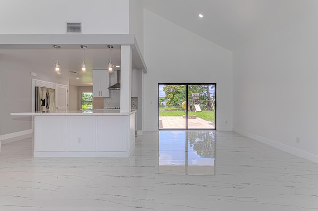 102 Granada St, Royal Palm Beach, FL 33411 - kitchen with stainless steel refrigerator with ice dispenser, light marble finish floors, open floor plan, high vaulted ceiling, and baseboards