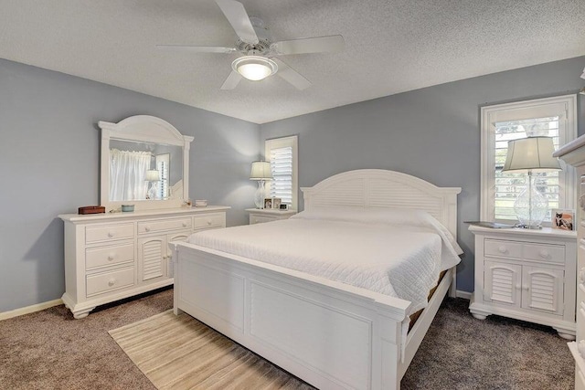 9692 Sills Dr E Unit 103, Boynton Beach, FL 33437 - bedroom featuring light carpet, ceiling fan, baseboards, and a textured ceiling