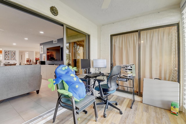 9692 Sills Dr E Unit 103, Boynton Beach, FL 33437 - home office with wood finished floors, recessed lighting, and a textured ceiling