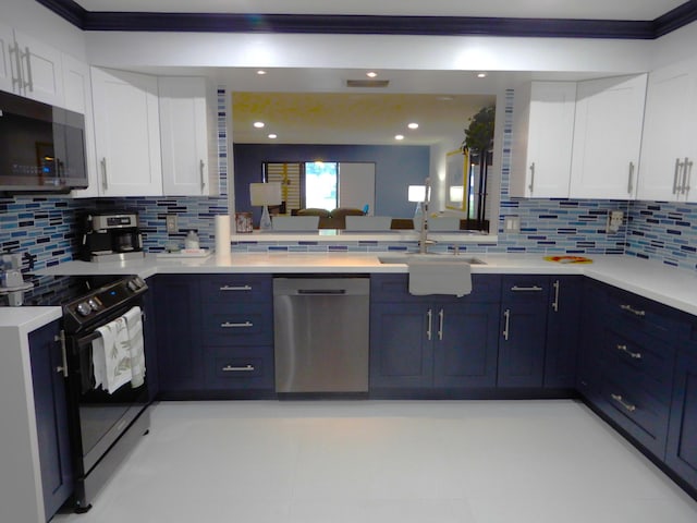 9692 Sills Dr E Unit 103, Boynton Beach, FL 33437 - kitchen featuring stainless steel appliances, a sink, light countertops, backsplash, and crown molding