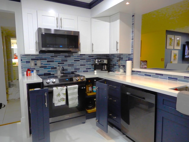 9692 Sills Dr E Unit 103, Boynton Beach, FL 33437 - kitchen with stainless steel appliances, decorative backsplash, white cabinetry, and light countertops