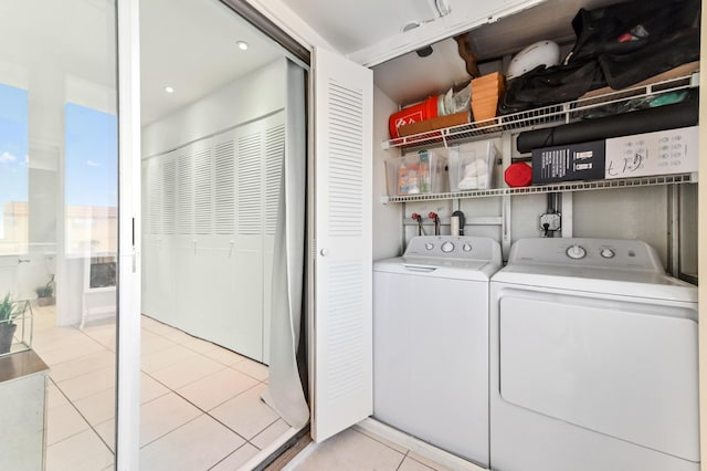 271 Saxony Unit F, Delray Beach, FL 33446 - laundry room with independent washer and dryer and light tile patterned floors