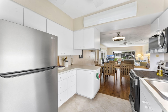 1470 S Ocean Blvd Unit 1101, Pompano Beach, FL 33062 - kitchen featuring stainless steel appliances, ceiling fan, light tile patterned flooring, white cabinets, and light countertops