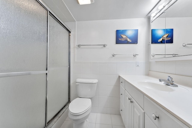 1470 S Ocean Blvd Unit 1101, Pompano Beach, FL 33062 - bathroom featuring tile walls, vanity, toilet, an enclosed shower, and tile patterned floors