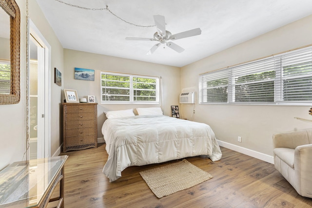 1470 S Ocean Blvd Unit 1101, Pompano Beach, FL 33062 - bedroom with baseboards, wood finished floors, a wall unit AC, and ceiling fan