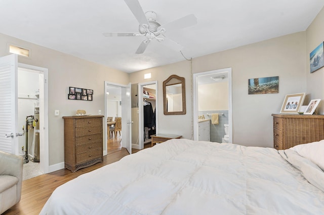 1470 S Ocean Blvd Unit 1101, Pompano Beach, FL 33062 - bedroom featuring a spacious closet, connected bathroom, light wood finished floors, a closet, and a ceiling fan