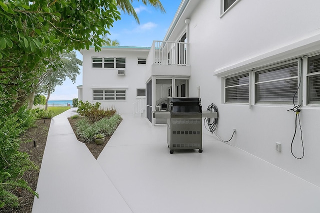 1470 S Ocean Blvd Unit 1101, Pompano Beach, FL 33062 - back of house with stucco siding, a patio area, and a water view