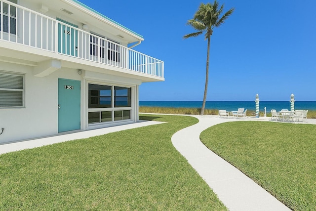 1470 S Ocean Blvd Unit 1101, Pompano Beach, FL 33062 - view of green lawn featuring a balcony, a water view, and a patio