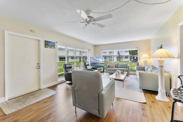 1470 S Ocean Blvd Unit 1101, Pompano Beach, FL 33062 - living area with healthy amount of natural light, ceiling fan, hardwood / wood-style floors, and baseboards
