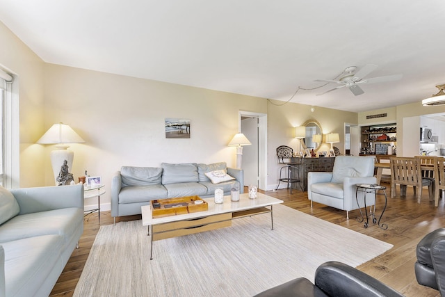 1470 S Ocean Blvd Unit 1101, Pompano Beach, FL 33062 - living room featuring a ceiling fan, wood finished floors, and baseboards
