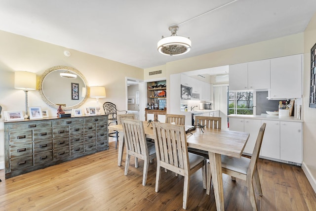 1470 S Ocean Blvd Unit 1101, Pompano Beach, FL 33062 - dining room featuring light wood-style floors
