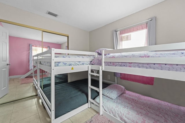 1528 Singletary Ave, Pahokee, FL 33476 - tiled bedroom featuring a closet