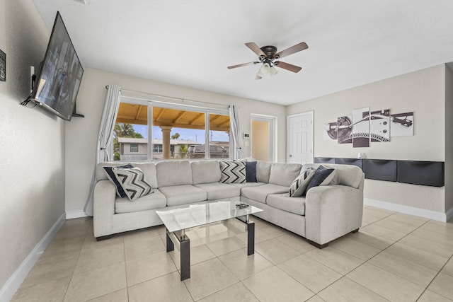 1528 Singletary Ave, Pahokee, FL 33476 - living area with ceiling fan, baseboards, and light tile patterned flooring