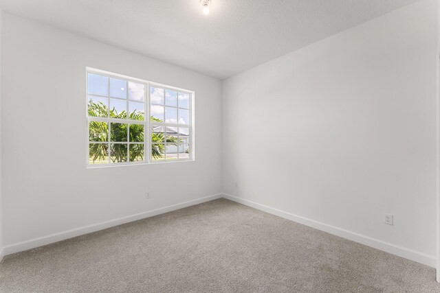 14408 SW Ellison Dr, Port Saint Lucie, FL 34987 - carpeted spare room with baseboards