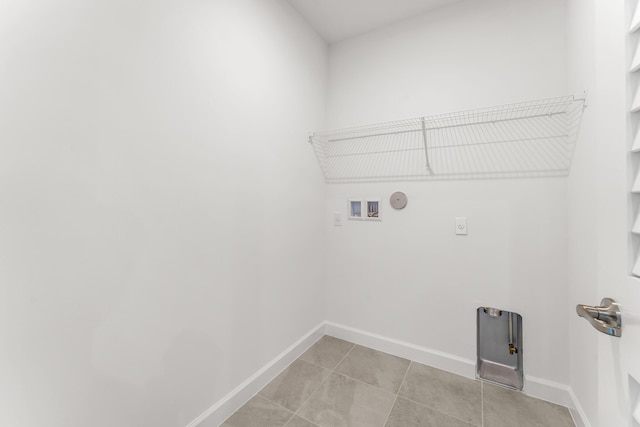 14408 SW Ellison Dr, Port Saint Lucie, FL 34987 - laundry area featuring washer hookup, gas dryer hookup, and baseboards